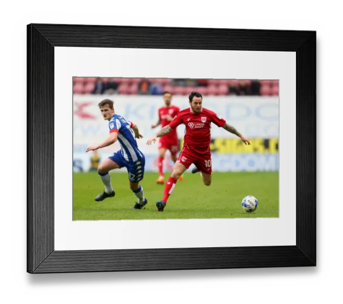 Framed Print : Bristol City's Lee Tomlin Clashes with Wigan Athletic's Callum Connolly during Sky Bet Championship Match Framed Print : Bristol City's Lee Tomlin Clashes with Wigan Athletic's Callum Connolly during Sky Bet Championship Match
