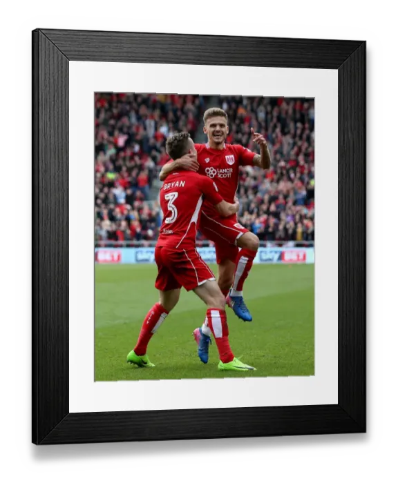 Framed Print : Unstoppable Duo: Paterson and Bryan's 2-0 Goal Celebration vs. Queens Park Rangers