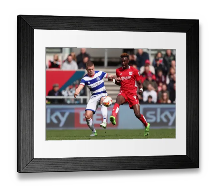 Framed Print : Bristol City's Tammy Abraham Slips Past QPR's Jake Bidwell in Championship Clash