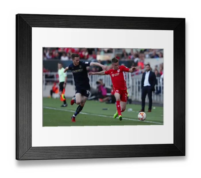 Framed Print : Bristol City vs Barnsley: Clash Between Joe Bryan and Marley Watkins