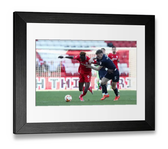 Framed Print : Bristol City's Tammy Abraham Outruns Barnsley's Angus MacDonald in Thrilling Championship Clash