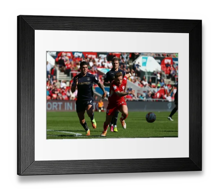 Framed Print : Bristol City's Matt Taylor Evades Barnsley's Alex Mowatt during Sky Bet Championship Clash Framed Print : Bristol City's Matt Taylor Evades Barnsley's Alex Mowatt during Sky Bet Championship Clash