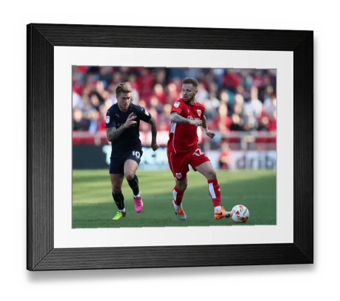 Framed Print : Matt Taylor Dodges George Moncur: Thrilling Moment from Bristol City vs Barnsley Championship Clash Framed Print : Matt Taylor Dodges George Moncur: Thrilling Moment from Bristol City vs Barnsley Championship Clash