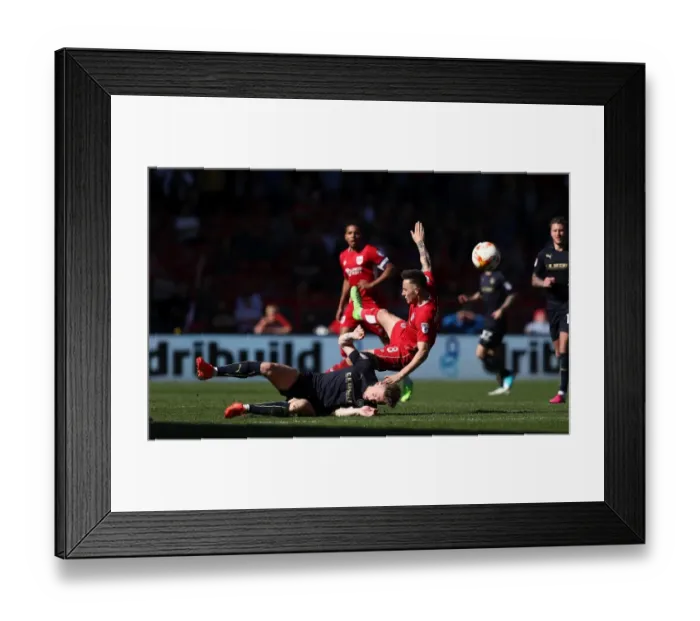 Framed Print : Bristol City vs Barnsley: Josh Brownhill vs Angus MacDonald - Intense Tackle Clash