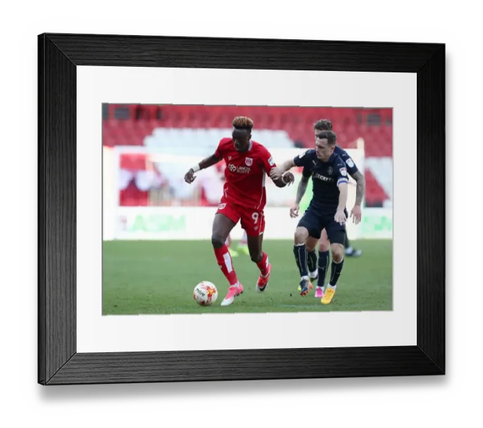 Framed Print : Tammy Abraham Outruns Josh Scowen: A Championship Showdown at Ashton Gate Framed Print : Tammy Abraham Outruns Josh Scowen: A Championship Showdown at Ashton Gate