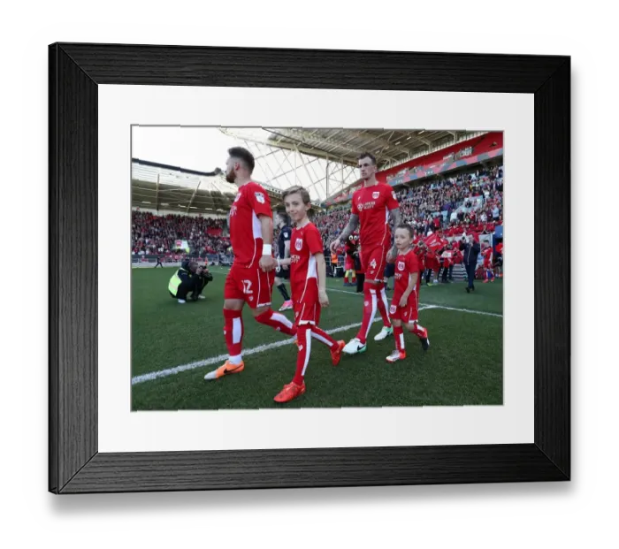Framed Print : Mascots Lead the Way: Sky Bet Championship Clash between Bristol City and Barnsley at Ashton Gate