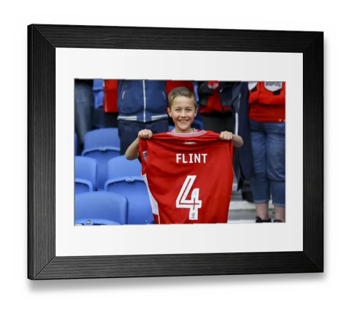 Framed Print : Aden Flint's Generous Moment: Giving Away His Shirt to a Thrilled Fan at Brighton & Hove Albion vs. Bristol City Framed Print : Aden Flint's Generous Moment: Giving Away His Shirt to a Thrilled Fan at Brighton & Hove Albion vs. Bristol City
