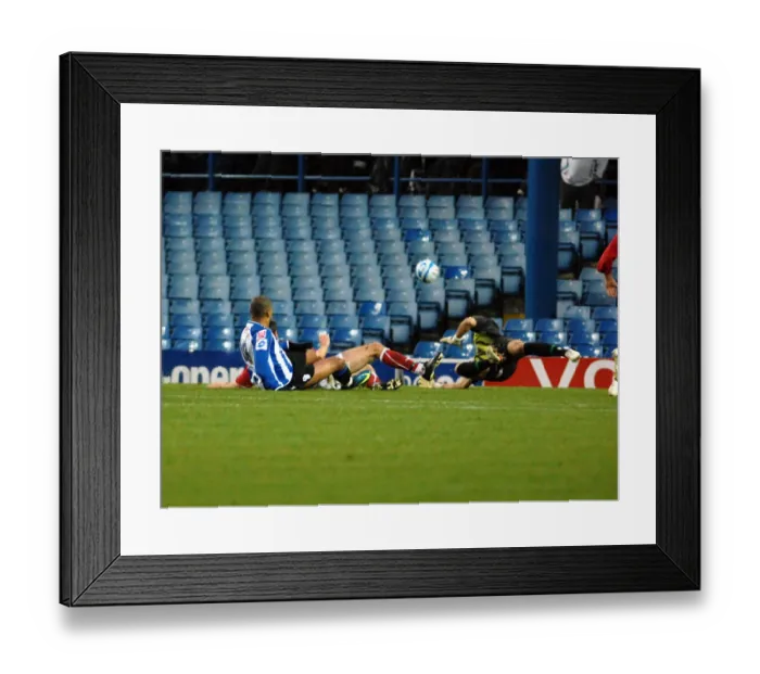 Framed Print : Keeper Adriano Basso saves from sheffield wednesday forward leon clarke Framed Print : Keeper Adriano Basso saves from sheffield wednesday forward leon clarke