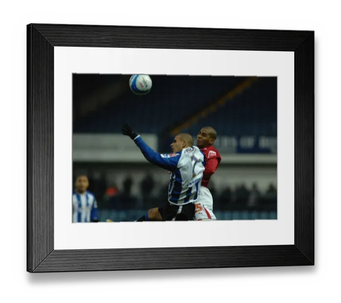 Framed Print : Intense Rivalry: Elliott vs. Tudgay - A Battle for the Ball Framed Print : Intense Rivalry: Elliott vs. Tudgay - A Battle for the Ball