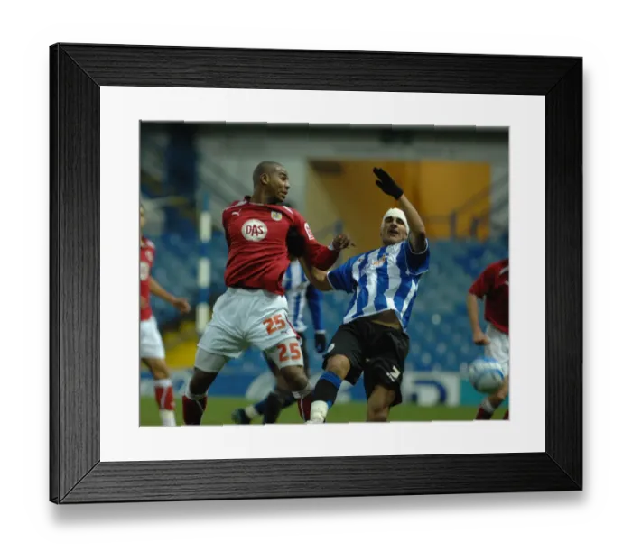 Framed Print : Marvin Elliott and Marcus Tudgay tussle for