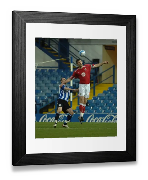 Framed Print : Jamie McCombe climes above the sheffield wednesday front line Framed Print : Jamie McCombe climes above the sheffield wednesday front line