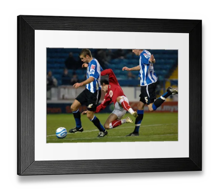 Framed Print : Ivan Sproule is muscled off the ball