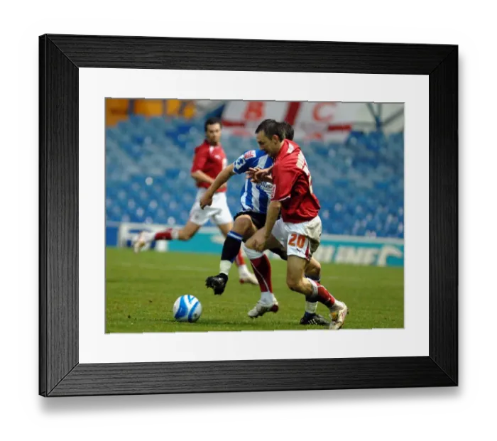 Framed Print : Gavin Williams tussles in midfield