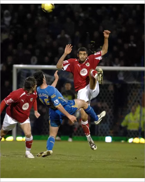 Liam Fontaine clears the ball ahead of Marc