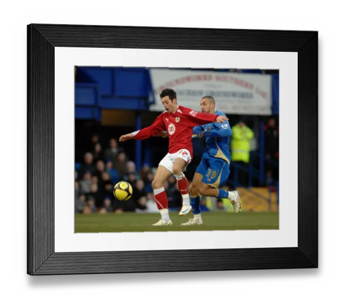 Framed Print : Ivan Sproule escapes the attentions of Nadir Belhadj as he runs through on goal Framed Print : Ivan Sproule escapes the attentions of Nadir Belhadj as he runs through on goal