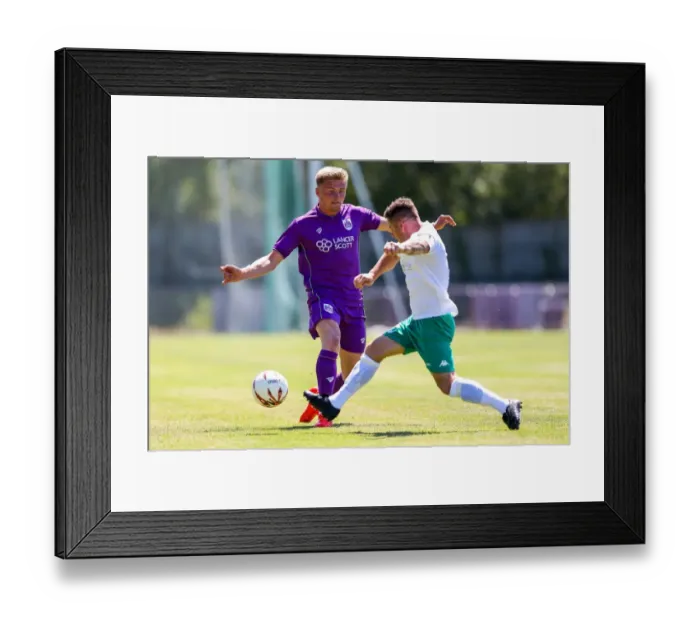 Framed Print : Taylor Moore in Action: Pre-season Friendly between Guernsey FC and Bristol City Framed Print : Taylor Moore in Action: Pre-season Friendly between Guernsey FC and Bristol City