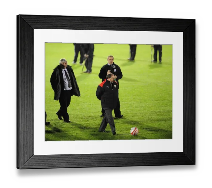 Framed Print : Gary Johnson checks the roll of the ball in pre pitch inspection