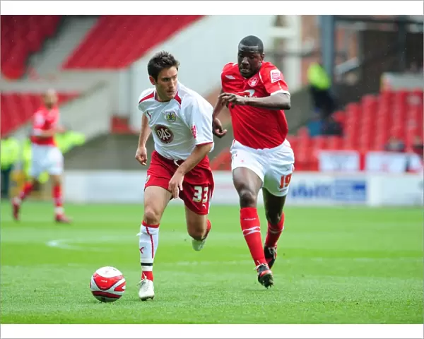 Lee Johnson gets away from Guy Moussi