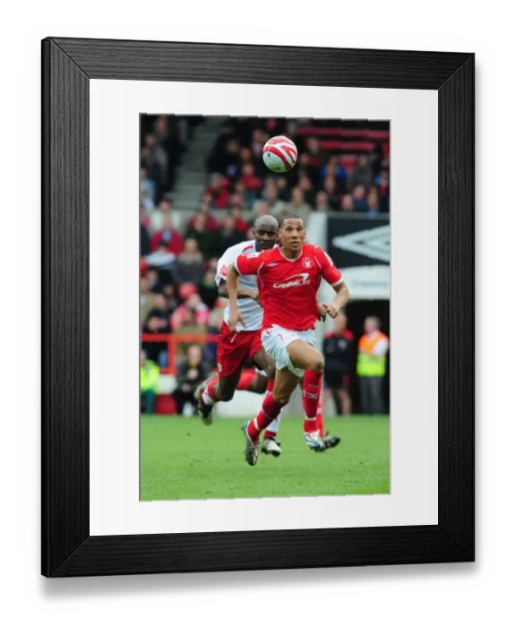 Framed Print : Dele Adebola chases down Kelvin Wilson