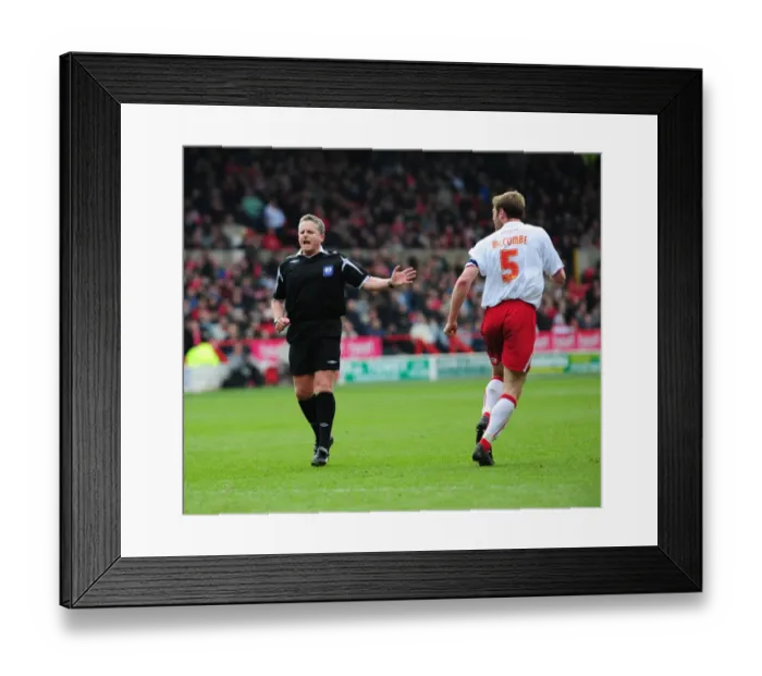 Framed Print : Jamie McCombe and referee Chris Webster exchange