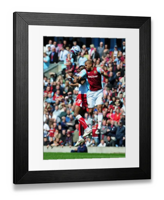 Framed Print : Dele Adebola jumps with Clarke Carlisle