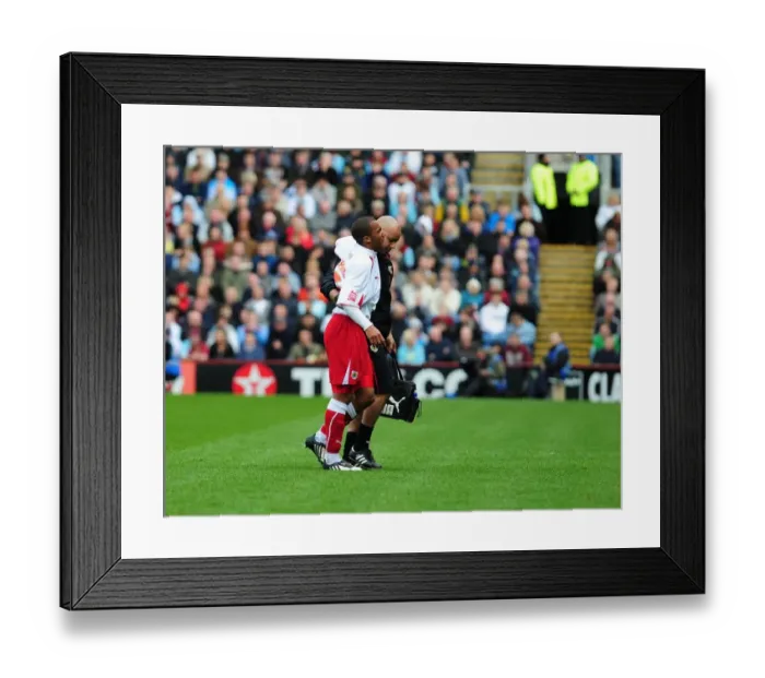 Framed Print : Nicky Maynard's Injury: A Moment of Silence at Burnley vs. Bristol City