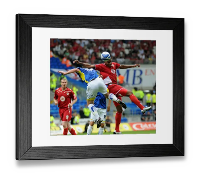 Framed Print : Bristol City`s Marvin Elliott wins this duel with Cardiff`s Mark Hudson