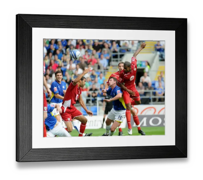 Framed Print : Bristol City`s Marvin Elliott powers this header goalwards Framed Print : Bristol City`s Marvin Elliott powers this header goalwards