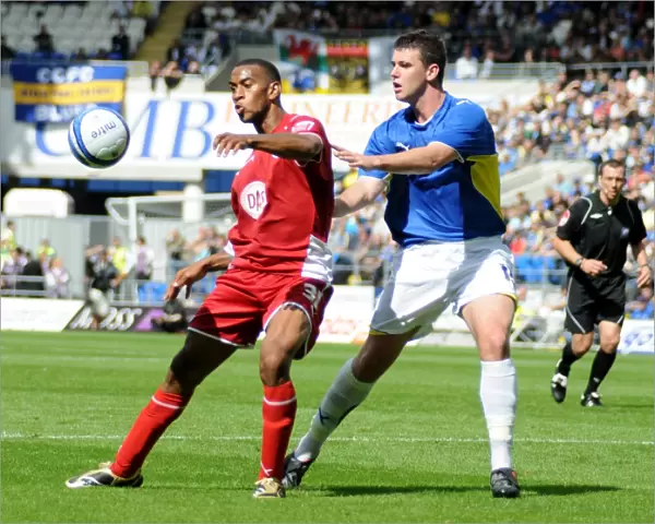 Bristol City`s Danny Haynes is closely marked by Cardiffs Tony Gerrard