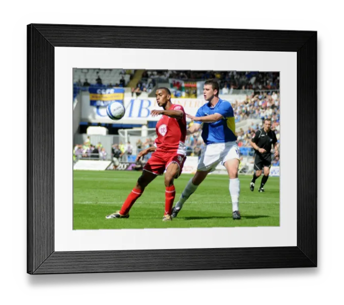 Framed Print : Bristol City`s Danny Haynes is closely marked by Cardiffs Tony Gerrard