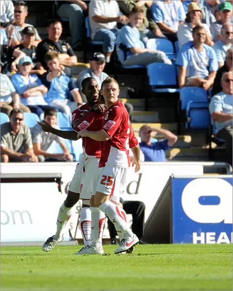 Liam Fontaine and Brian Wilson smother Nicky Maynard after his equalizer