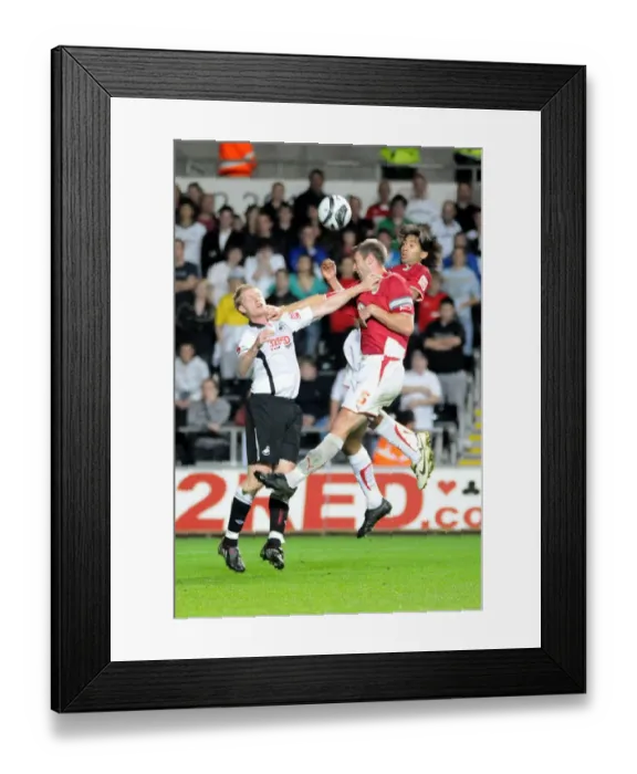 Framed Print : Jamie McCombe and Alvaro Saborio pressure the Swansea defence Framed Print : Jamie McCombe and Alvaro Saborio pressure the Swansea defence