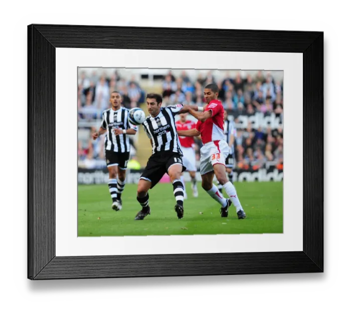 Framed Print : A Force to Reckon With: Khizanishvili and Saborio's Unforgettable Clash - Newcastle Utd vs. Bristol City