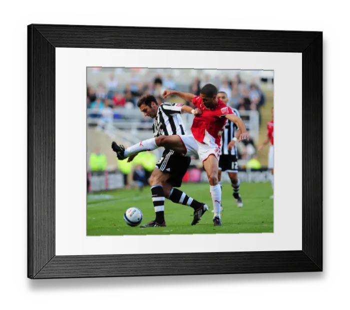 Framed Print : Powerful Duo in Action: Zurab Khizanishvili and Alvaro Saborio at Newcastle United vs. Bristol City