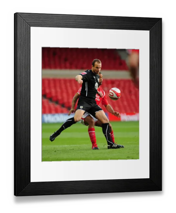 Framed Print : Louis Carey holds off David McGoldrick