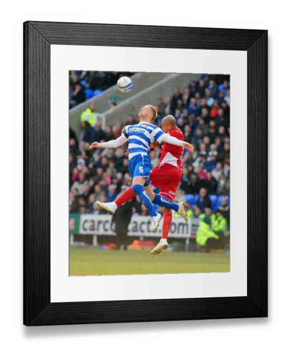 Framed Print : Challenge in the Sky: Iwelumo vs. Mills in the Thrilling Championship Clash between Reading and Bristol City Framed Print : Challenge in the Sky: Iwelumo vs. Mills in the Thrilling Championship Clash between Reading and Bristol City