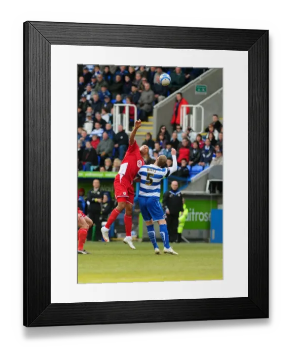Framed Print : Clash in the Sky: Iwelumo vs. Mills over a Looming Aerial Ball - Reading vs. Bristol City, Championship 2010 Framed Print : Clash in the Sky: Iwelumo vs. Mills over a Looming Aerial Ball - Reading vs. Bristol City, Championship 2010