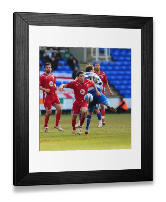 Framed Print : Johnson vs Howard: Intense Battle in the Championship Clash between Reading and Bristol City - 13 / 03 / 2010