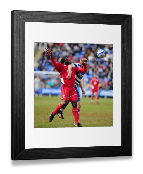 Framed Print : Battling for Supremacy: Akinde vs. Gunnarsson in the Championship Clash between Reading and Bristol City (13 / 03 / 2010) Framed Print : Battling for Supremacy: Akinde vs. Gunnarsson in the Championship Clash between Reading and Bristol City (13 / 03 / 2010)
