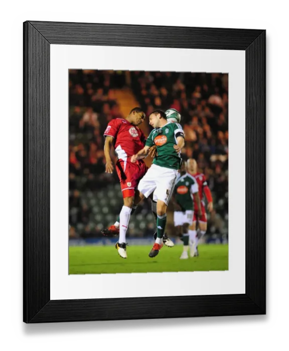 Framed Print : Bristol City's Marvin Elliott vs Plymouth Argyle's Carl Fletcher: Aerial Battle in the Championship (16-03-2010) Framed Print : Bristol City's Marvin Elliott vs Plymouth Argyle's Carl Fletcher: Aerial Battle in the Championship (16-03-2010)