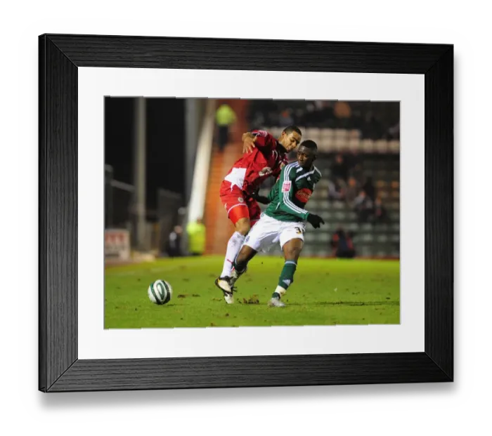 Framed Print : Intense Rivalry: Marvin Elliott vs. Yannick Bolasie - Championship Showdown between Plymouth Argyle and Bristol City (16 / 03 / 2010) Framed Print : Intense Rivalry: Marvin Elliott vs. Yannick Bolasie - Championship Showdown between Plymouth Argyle and Bristol City (16 / 03 / 2010)