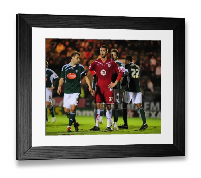 Framed Print : Bristol City's Stefan Maierhofer Faces Off Against Plymouth Argyle Defense in Championship Clash Framed Print : Bristol City's Stefan Maierhofer Faces Off Against Plymouth Argyle Defense in Championship Clash