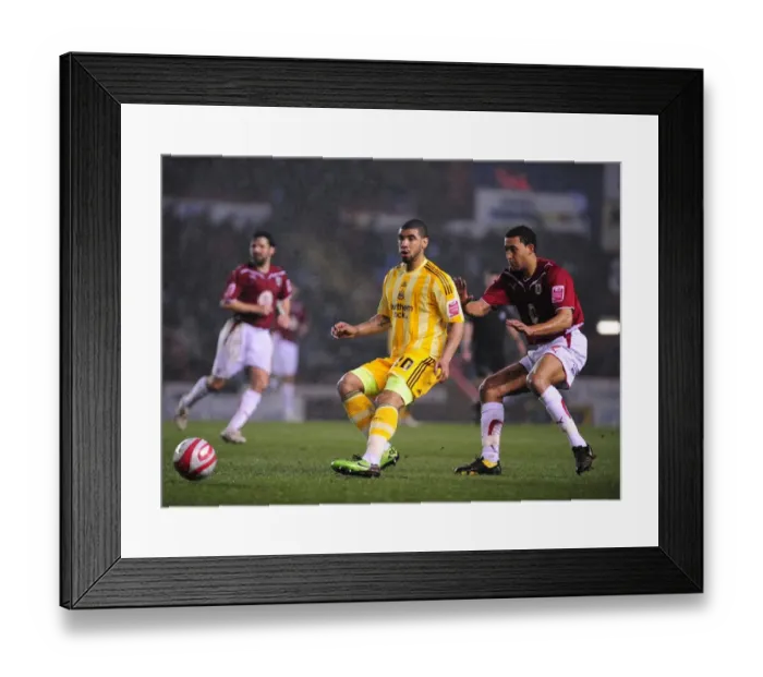 Framed Print : Battling for Supremacy: Lewin Nyatanga vs. Leon Best in the 2010 Championship Clash between Bristol City and Newcastle United