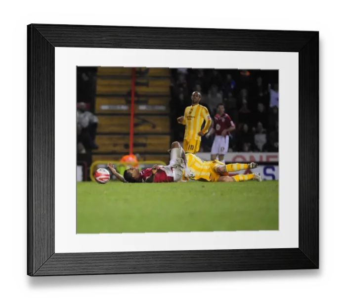Framed Print : Bristol City vs Newcastle United: Marvin Elliott Fouls by Danny Guthrie - Championship Match (2010) Framed Print : Bristol City vs Newcastle United: Marvin Elliott Fouls by Danny Guthrie - Championship Match (2010)