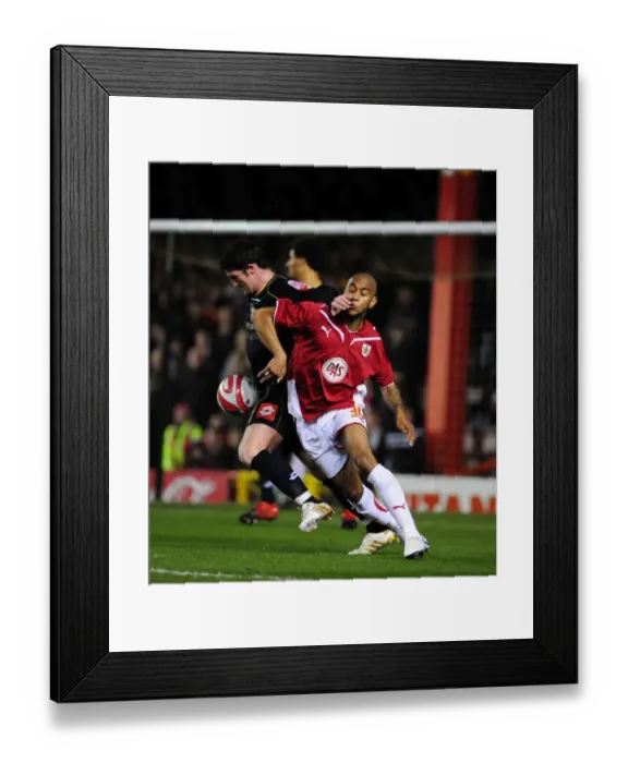 Framed Print : Bristol City vs Barnsley: Intense Battle for Possession between Danny Haynes and Jonathan Macken (Championship Football Match, 23 / 03 / 2010)