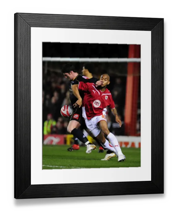 Framed Print : Intense Championship Showdown: Haynes vs Macken's Battle for Possession - Bristol City vs Barnsley (23 / 03 / 2010) Framed Print : Intense Championship Showdown: Haynes vs Macken's Battle for Possession - Bristol City vs Barnsley (23 / 03 / 2010)