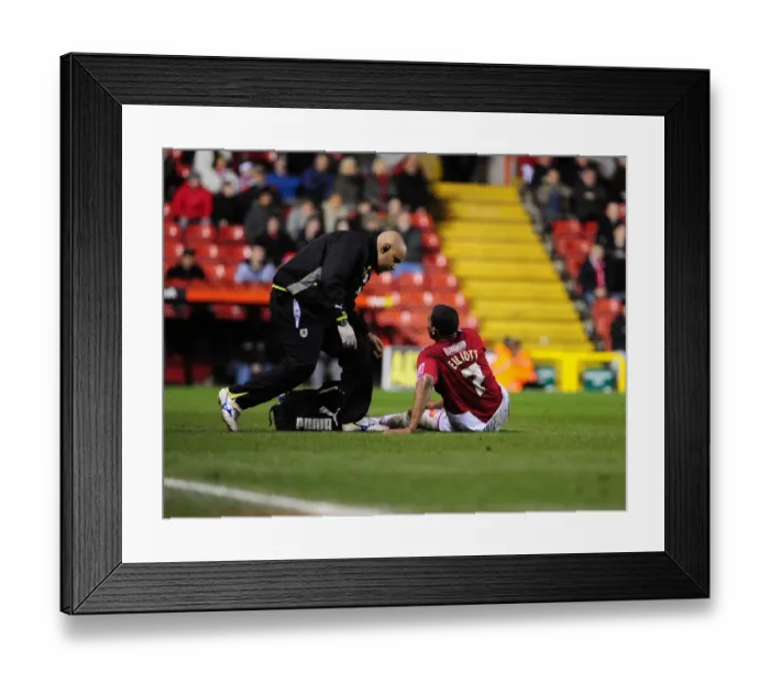 Framed Print : Bristol City's Marvin Elliott Receives Treatment During Championship Match vs Barnsley (23 / 03 / 2010) Framed Print : Bristol City's Marvin Elliott Receives Treatment During Championship Match vs Barnsley (23 / 03 / 2010)