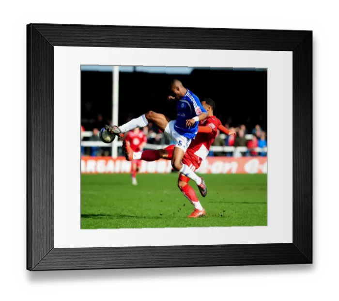 Framed Print : Battling for Supremacy: Zakuani vs. Maynard in the Peterborough vs. Bristol City Championship Clash (March 2010)