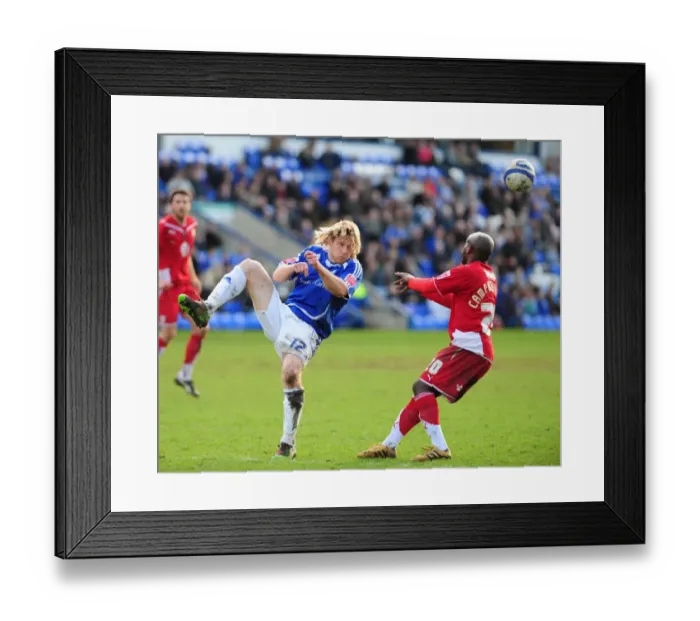 Framed Print : Bristol City FC: Peterborough's Mackail-Smith Clears the Ball in Championship Clash (March 2010)