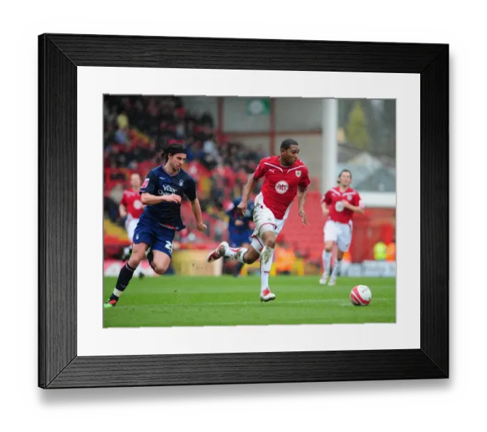 Framed Print : Chasing the Championship Victory: Marvin Elliott vs. George Boyd - Intense Rivalry on the Pitch (Bristol City vs. Nottingham Forest, 03 / 04 / 2010)
